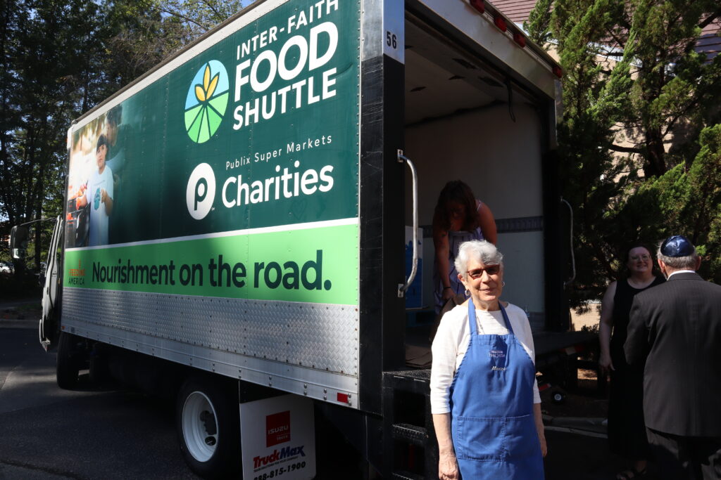 35th Annual Yom Kippur Food Drive Lady standing in front of truck